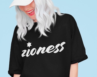 May include: A black t-shirt with a white star and the word "zioness" in a white cursive font.