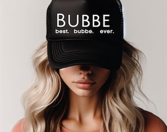 May include: A black trucker hat with a white logo that says "BUBBE best. bubbe. ever."