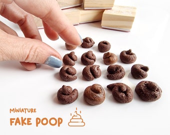 Miniature realistic fake poop tokens. For fun, gaming or gag gifts.