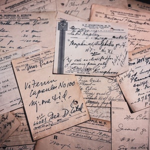 May include: A collection of vintage handwritten prescriptions and pharmacy documents. The aged papers feature faded ink, medical terminology, and various signatures. The documents are arranged in a layered composition, evoking a sense of history and nostalgia.