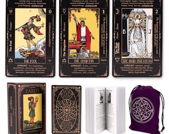 May include: A tarot card deck set featuring three illustrated cards labeled The Fool, The Magician, and The High Priestess with black borders and gold text. Includes a matching storage box, a card back design, an instruction booklet, and a purple pouch.