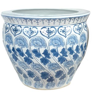 May include: A large, round ceramic planter with a blue and white floral design. The planter features a repeating pattern of blue flowers and leaves against a white background. The rim has a decorative border. Ideal for indoor or outdoor use.