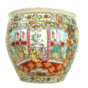 May include: A large, round, antique Chinese planter with a wide rim. The planter features a detailed, hand-painted scene of figures in traditional clothing, set against a backdrop of a room with bamboo and floral patterns. The color palette includes red, yellow, green, and pink.
