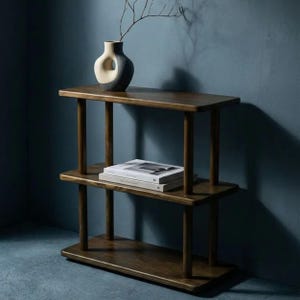 🪵 Narrow Solid Wood 3 Tier End Side Table

Space Saving Slim Book Organizer | Small Spaces Coffee Table for Sofa

Designed for compact living areas, this narrow solid wood 3 tier end side table is the perfect combination of style and functionality.

Its slim profile makes it ideal for placing next to a sofa, couch, or bed, while the three-tier design provides practical storage for books, décor, and everyday essentials.

A beautiful solution for small spaces without compromising on elegance ✨