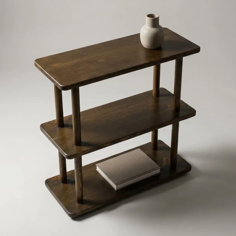 🪵 Narrow Solid Wood 3 Tier End Side Table

Space Saving Slim Book Organizer | Small Spaces Coffee Table for Sofa

Designed for compact living areas, this narrow solid wood 3 tier end side table is the perfect combination of style and functionality.

Its slim profile makes it ideal for placing next to a sofa, couch, or bed, while the three-tier design provides practical storage for books, décor, and everyday essentials.

A beautiful solution for small spaces without compromising on elegance ✨