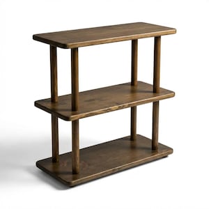 🪵 Narrow Solid Wood 3 Tier End Side Table

Space Saving Slim Book Organizer | Small Spaces Coffee Table for Sofa

Designed for compact living areas, this narrow solid wood 3 tier end side table is the perfect combination of style and functionality.

Its slim profile makes it ideal for placing next to a sofa, couch, or bed, while the three-tier design provides practical storage for books, décor, and everyday essentials.

A beautiful solution for small spaces without compromising on elegance ✨