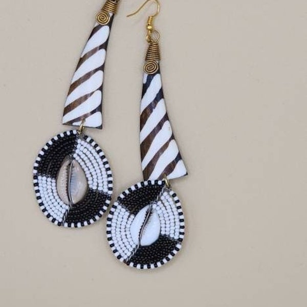 African cowrie shell handmade with bone materials, earrings with brown and white zebra pattern and mini black white beads and cowrie shell
