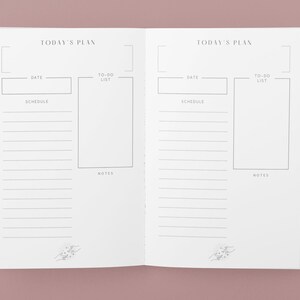 May include: A white planner with two pages open, each page has a section for "Today's Plan" with headings for "Date", "To-Do List", "Schedule", and "Notes".