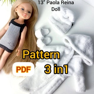 May include: A PDF pattern for a 13" Paola Reina doll. The pattern includes a white hooded robe, a white hat, and a pair of white slippers. The pattern is labeled "3 in 1" and "PDF".