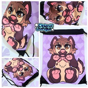 May include: A purple drawstring bag with a cartoon image of a brown and white dog wearing a pink bow. The dog is sitting on its hind legs with its paws in the air. The bag has a black drawstring and a white background with pink hearts.