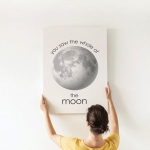 May include: A white canvas print with a black and white image of the moon and the text "You saw the whole of the moon".
