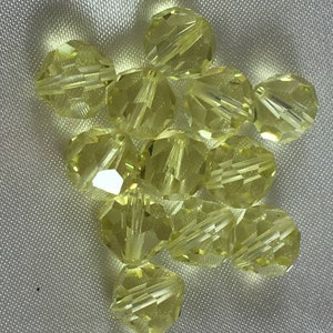 Swarovski vintage round (Art.  5000) Jonquil non-AB finish 8mm beads. Per bead.