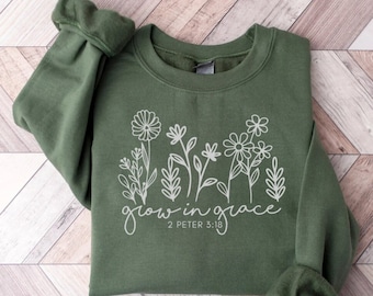 May include: A green sweatshirt with a white graphic of flowers and the text "grow in grace 2 Peter 3:18"