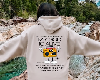 May include: A white hoodie featuring a cartoon boombox graphic with the text "I won't be quiet, My God is Alive, Psalms 150, How can I keep it inside, Praise the Lord, Oh! My Soul."