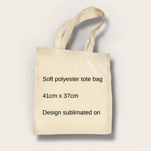 May include: A cream-colored tote bag made of soft polyester. The bag measures 16 inches by 14.5 inches. The text on the bag reads "Soft polyester tote bag", "41cm x 37cm", and "Design sublimated on".