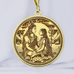May include: Gold pendant necklace featuring a detailed engraving of Shiva and Parvati, Hindu deities, sitting together. The pendant is round and has a decorative border.