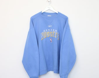 Vintage Reebok Denver Nuggets sweatshirt in blue. Best fits XL