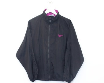 Vintage Reebok Trainingsjacke in Schwarz. Passt am besten S