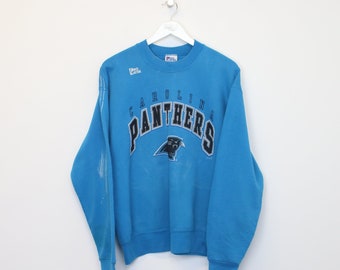 sweat-shirt vintage des Panthers de la Caroline en bleu. Taille idéale pour le L