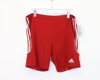 Vintage Adidas shorts in red. Best fits L