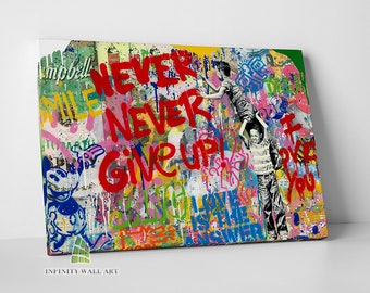 May include: A colorful abstract painting with a graffiti style. The painting features a red, yellow, and blue color scheme with a variety of textures and patterns. The words "NEVER GIVE UP!" are written in large, bold letters in red paint. The painting also features a variety of other words and phrases, including "LOVE IS THE ANSWER" and "DREAM BIG".