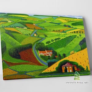 May include: A painting of a green, rolling countryside with a winding road and houses. The painting is done in a stylized, almost cartoonish style.