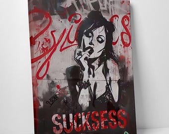 May include: Black and white canvas art print featuring a woman with red lipstick, with the word "SUCKSESS" in red at the bottom. The word "PSYCHOS" is written in red on the top left.