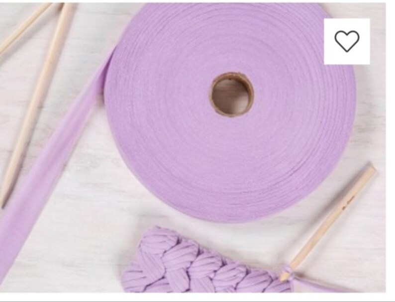 May include: A roll of lavender colored cotton rope with a wooden knitting needle and a crocheted piece of fabric.