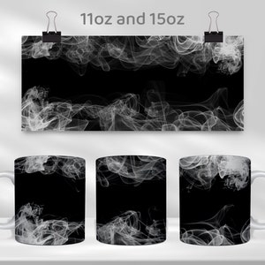 May include: Two white ceramic mugs with a black background and a white abstract design of smoke. The mugs are available in 11oz and 15oz sizes.