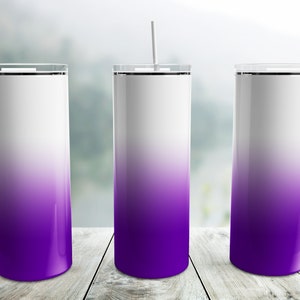 May include: Three stainless steel tumblers with a white to purple ombre design and white lids. Each tumbler has a white straw.