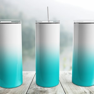 May include: Three stainless steel tumblers with a white to turquoise ombre design. Each tumbler has a black lid and a white straw.