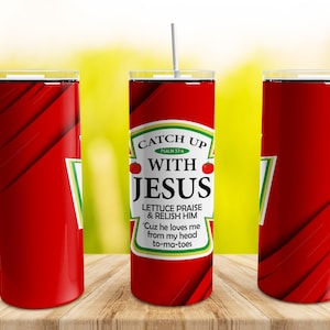 May include: Red and white tumbler with a ketchup bottle design. The label reads "Catch Up With Jesus" and includes the text "Lettuce Praise & Relish Him 'Cuz he loves me from my head to-ma-toes".
