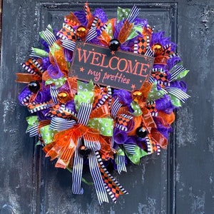 Deco Mesh Halloween Wreath for the Front Door with a Sign that says Welcome My Pretties. Purple, Orange, and Black and White Halloween Decor