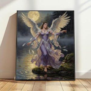 May include: A framed wall art print depicting a figure with large white feathered wings wearing a flowing lavender dress. The figure stands on a mossy rock by a misty lake at night under a full moon, with floating feathers surrounding them.