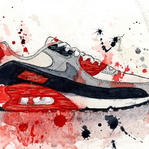 May include: Watercolor painting of a red, white, and gray sneaker with black accents. The sneaker is surrounded by red and black paint splatters on a white background.