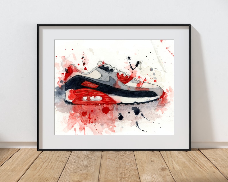 May include: A watercolor painting of a white, gray, and red Nike Air Max 90 shoe with red and black paint splatters on a white background.