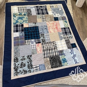 May include: A patchwork quilt with a blue and white plaid pattern, featuring a variety of fabrics in different colors and patterns, including floral, geometric, and paisley designs. The quilt is bordered with a dark blue fabric.
