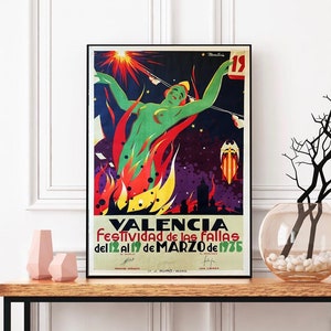 May include: A vintage poster advertising the "Festividad de las Fallas" in Valencia, Spain. The poster features a woman in a green dress standing in a fiery inferno with a starburst above her head. The text on the poster reads "Valencia Festividad de las Fallas del 12 al 19 de MARZO de 1936."