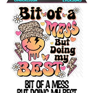 May include: A colorful graphic with the text "Bit of a MESS But Doing my BEST". The design includes a smiley face with a leopard print hat, lightning bolts, butterflies, and flowers. The words "CINDERLYSSA" and "EVERYDAY" are also present.