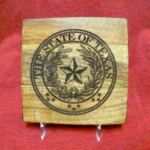 Four Acacia hardwood coaster featuring a version of the Texas Seal.