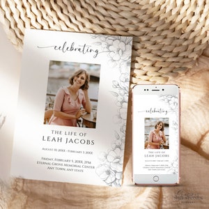 May include: A black and white floral design with the word "celebrating" in cursive script. A photo of a woman is in the center of the design. The text below the photo reads "The Life of Leah Jacobs" and includes dates and a memorial service location.