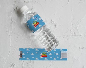 May include: A blue and white water bottle label with the text "It's a Boy Story" and a cartoon image of a baby. The label is wrapped around a clear plastic water bottle.