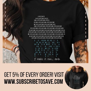 May include: Black t-shirt featuring a graphic design of a binary code pattern and the text "I make it rain... data".