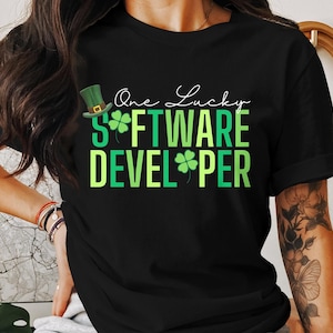 May include: Black t-shirt with green shamrock graphics and the text "One Lucky Software Developer".
