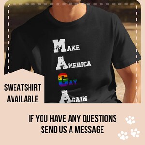 May include: Black t-shirt with white text that reads "MAKE AMERICA GAY AGAIN" with a rainbow stripe replacing the "A" in "GAY".