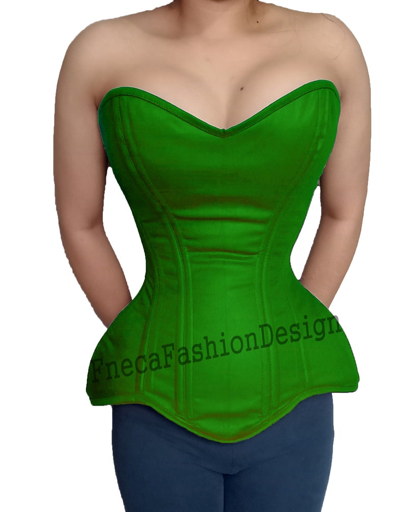 May include: A green strapless corset with boning and a sweetheart neckline. The corset has a  pointed bottom and a  "FnecaFashionDesign" watermark.