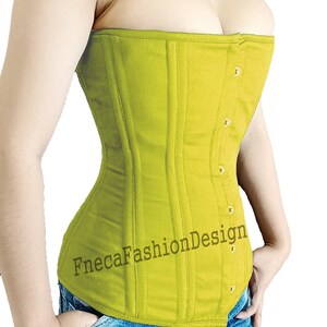 May include: A lime green corset with gold buttons and the text "FnecaFashionDesign" on the front. The corset is worn over blue jeans with white and pink graffiti.