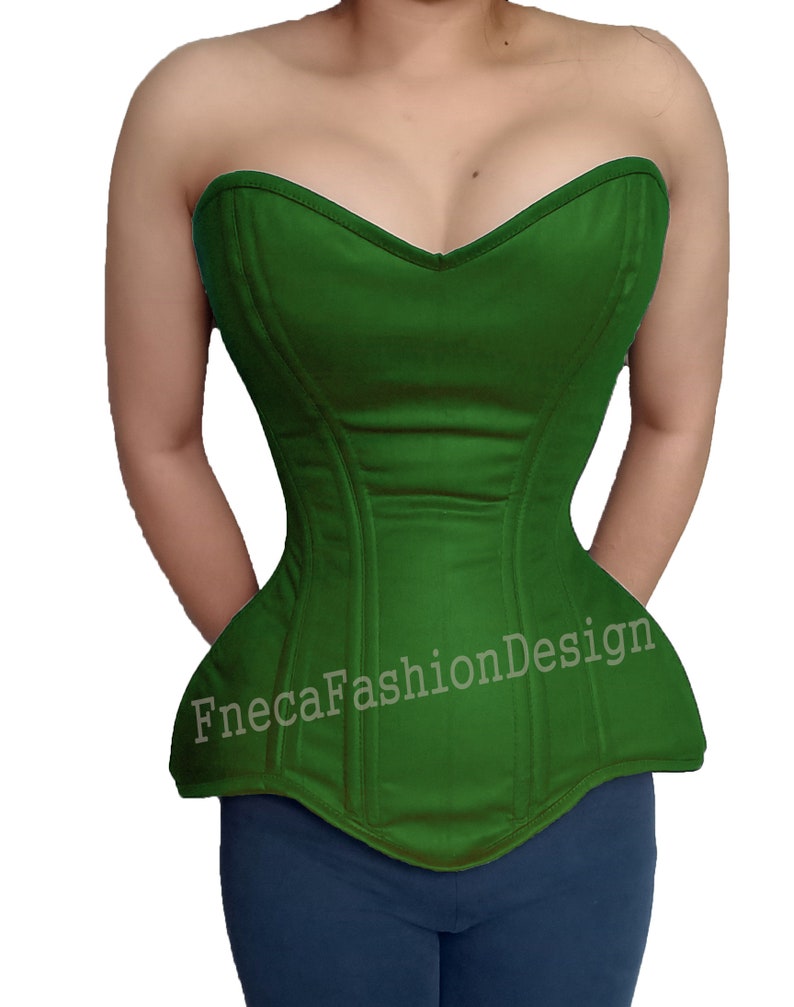 May include: A green strapless corset with a sweetheart neckline and a pointed bottom. The corset has boning and seams for structure. The text "FnecaFashionDesign" is printed on the front of the corset.