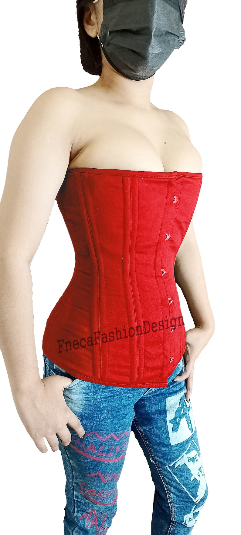 May include: A red cotton corset with a busk closure and a FnecaFashionDesign logo. The corset is worn over a pair of blue jeans with a graphic print.