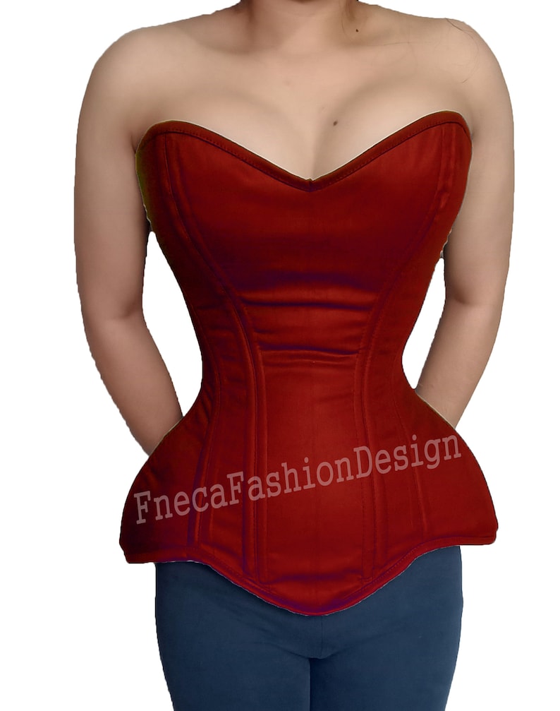 May include: A red strapless corset with a sweetheart neckline and a pointed bottom. The corset has boning and is made of a smooth fabric. The text "FnecaFashionDesign" is printed on the front of the corset.